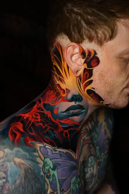 colour realism stylized woman's face and flames tattoo on head and neck