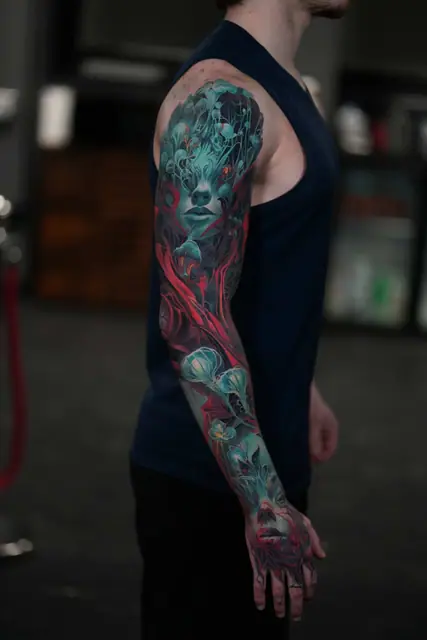 colour realism surreal face with organic elements tattooed as a full sleeve