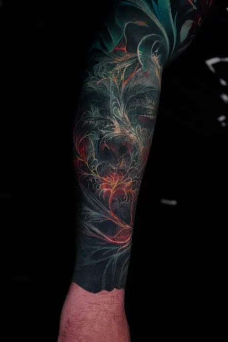 colour realism teal fractal and smoke full sleeve tattoo