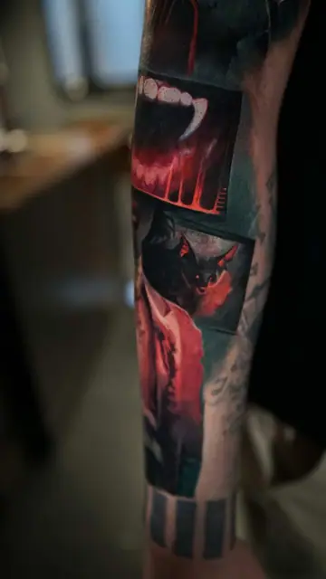 colour realism vampire fangs and bat tattoo on forearm