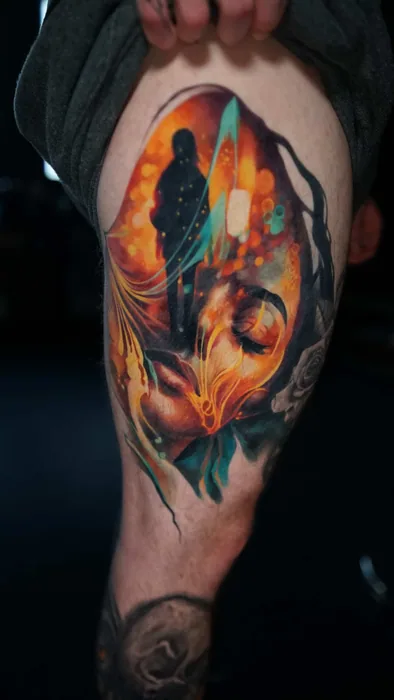 colour realism warriors and woman's face in firelight tattoo on upper arm