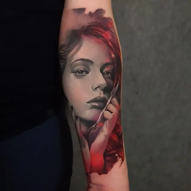 colour realism woman portrait tattoo on forearm