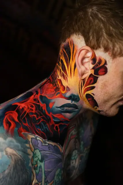 colour realism woman's face and lava tattoo on neck and jaw