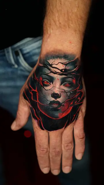 colour realism woman's face with red eyes and glowing lines tattoo on hand