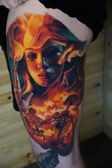 colour realism woman and skeletons in flames tattoo on thigh