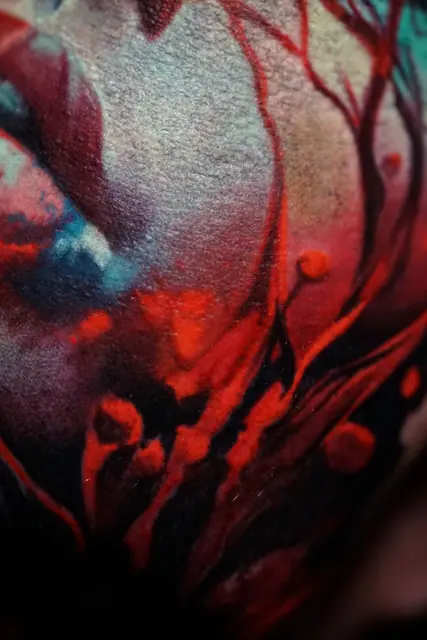 colourful abstract organic tattoo, possibly on upper arm/shoulder