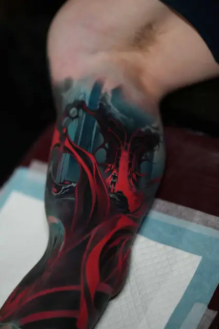 dark fantasy scene colour realism tattoo on forearm