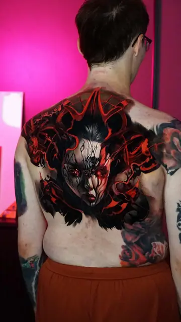 demonic face colour realism tattoo on back