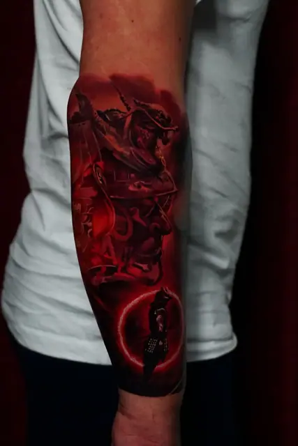 red colour realism samurai warrior tattoo on forearm